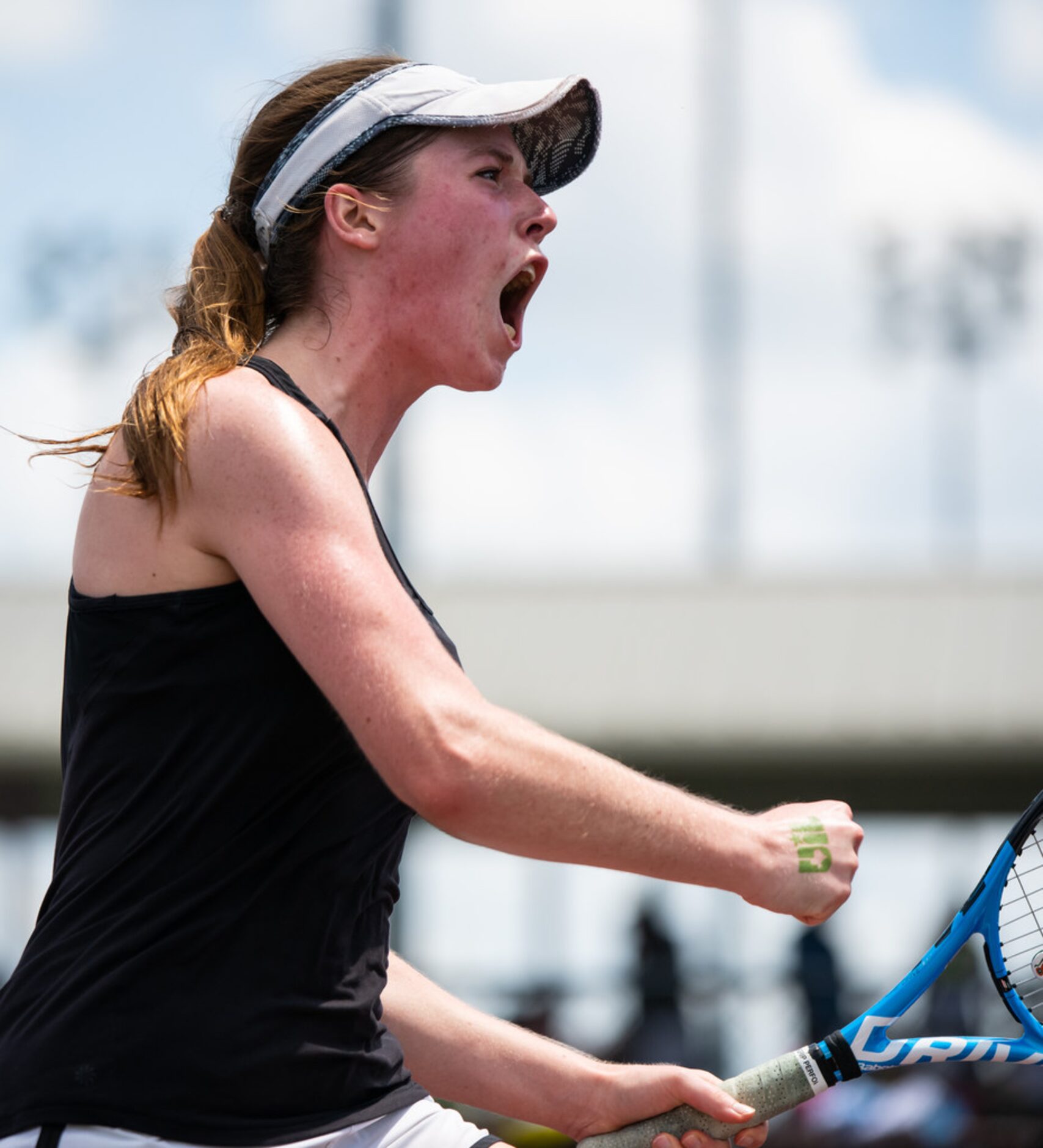 Southlake Carroll's Samantha Lowe celebrates during a doubles match with teammate Brennan...