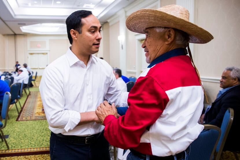 U.S. Representative Joaquin Castro of San Antonio greets Fidel Acevedo, delegate from...