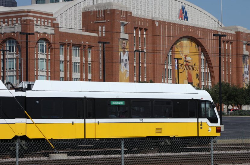 DART Rail runs in front of American Airlines Center a day before the Mavericks parade which...