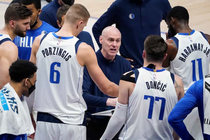 Dallas Mavericks head coach Rick Carlisle talks with center Kristaps Porzingis (6), guard...