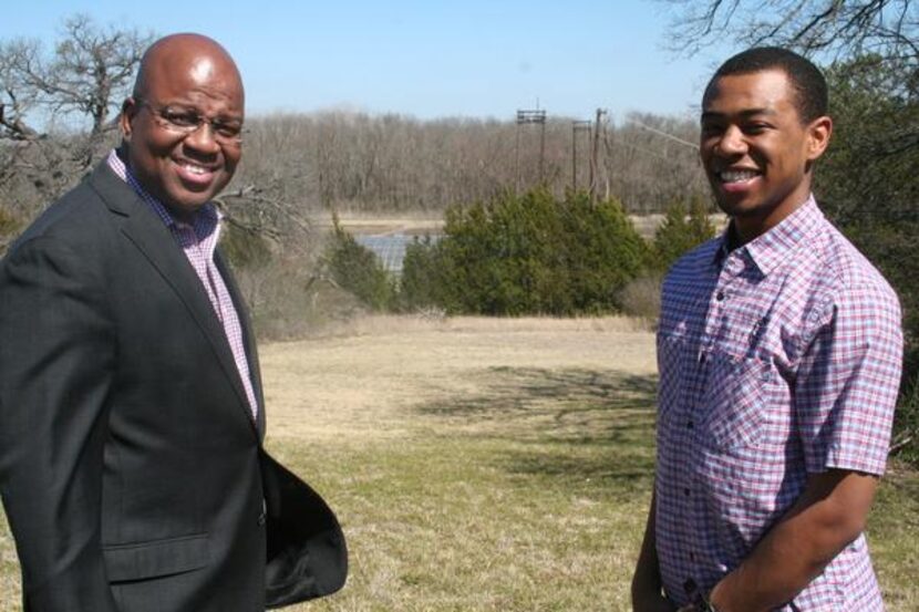 
Paul Quinn College Director of Development Dennis Coleman and freshman business...