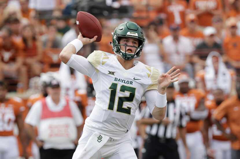 Baylor quarterback Charlie Brewer (12) throws against Texas during the first half of an NCAA...