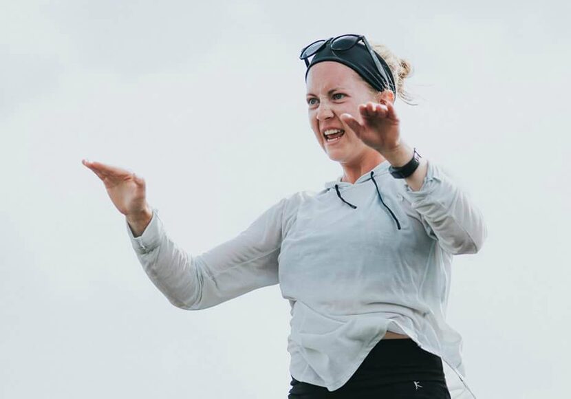 Kristin Hodges, a Crossmen drum major, conducts during a rehearsal.