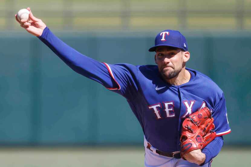 Texas Rangers’ Nathan Eovaldi throws a pitch during the first inning of a spring training...