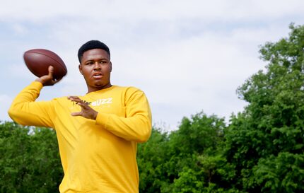 Former South Oak Cliff High School quarterback David Johnson throws a football around for a...