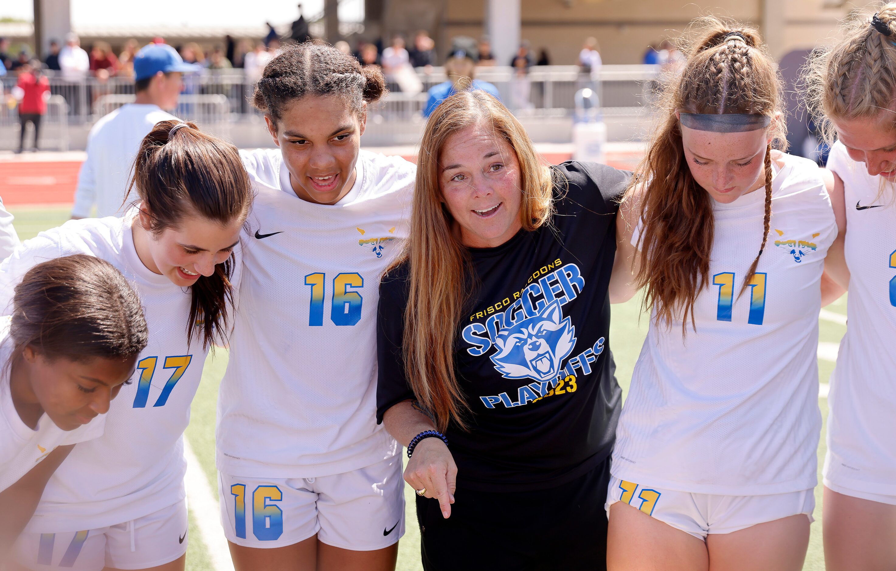 Frisco head coach Jaime Leraas (center) gathers her players, including Bella Hermundson...