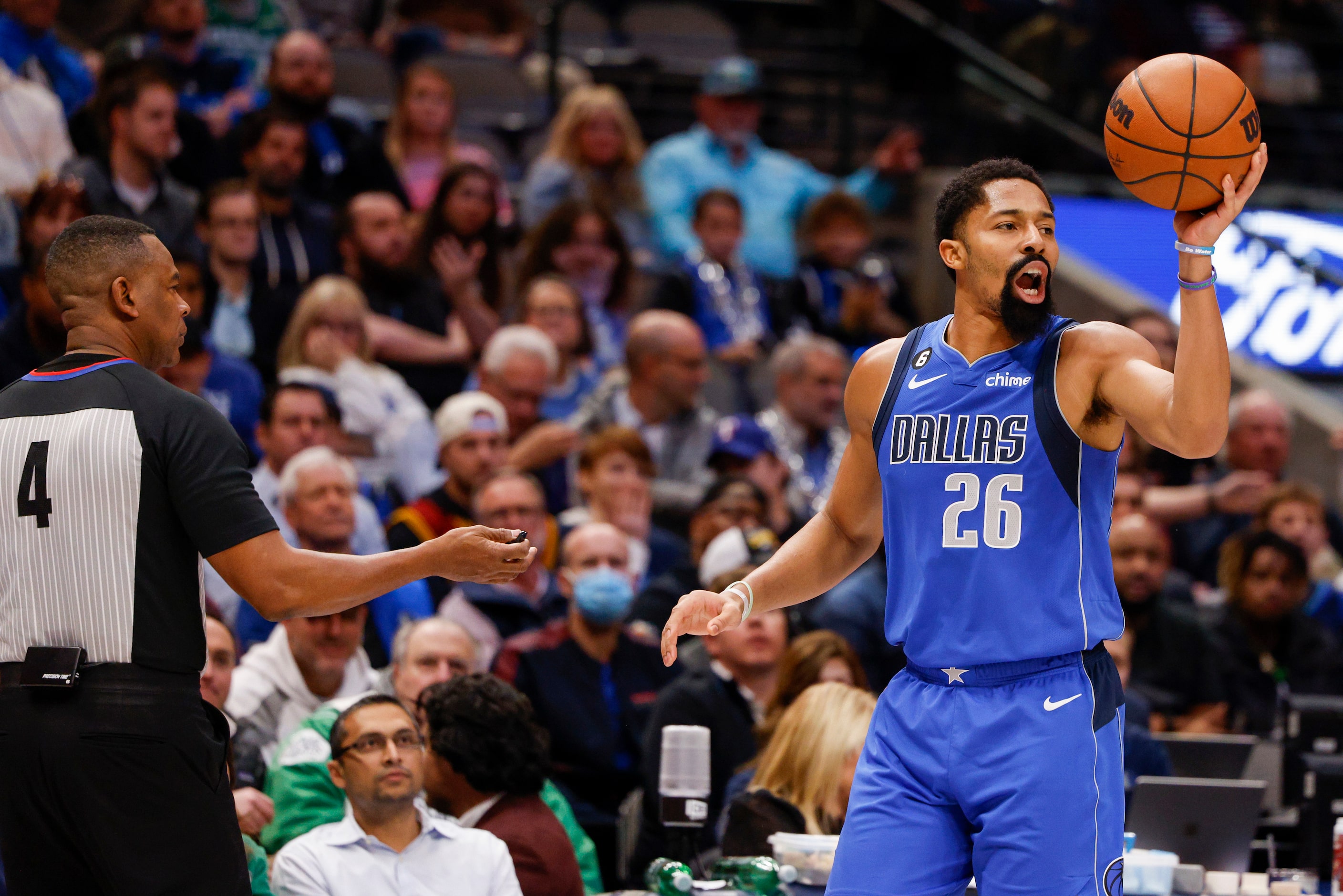 Dallas Mavericks guard Spencer Dinwiddie (26) argues a traveling call with referee Sean...