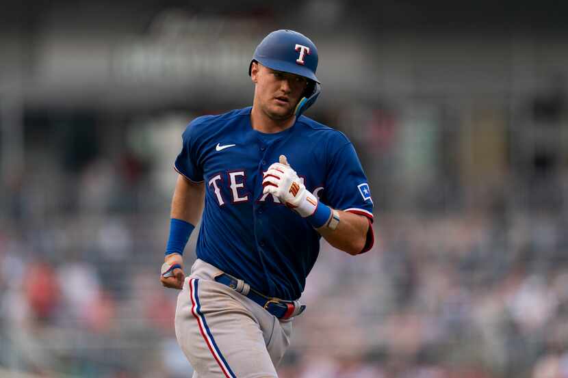 Texas Rangers' Josh Jung runs toward home plate after hitting a home run during the sixth...