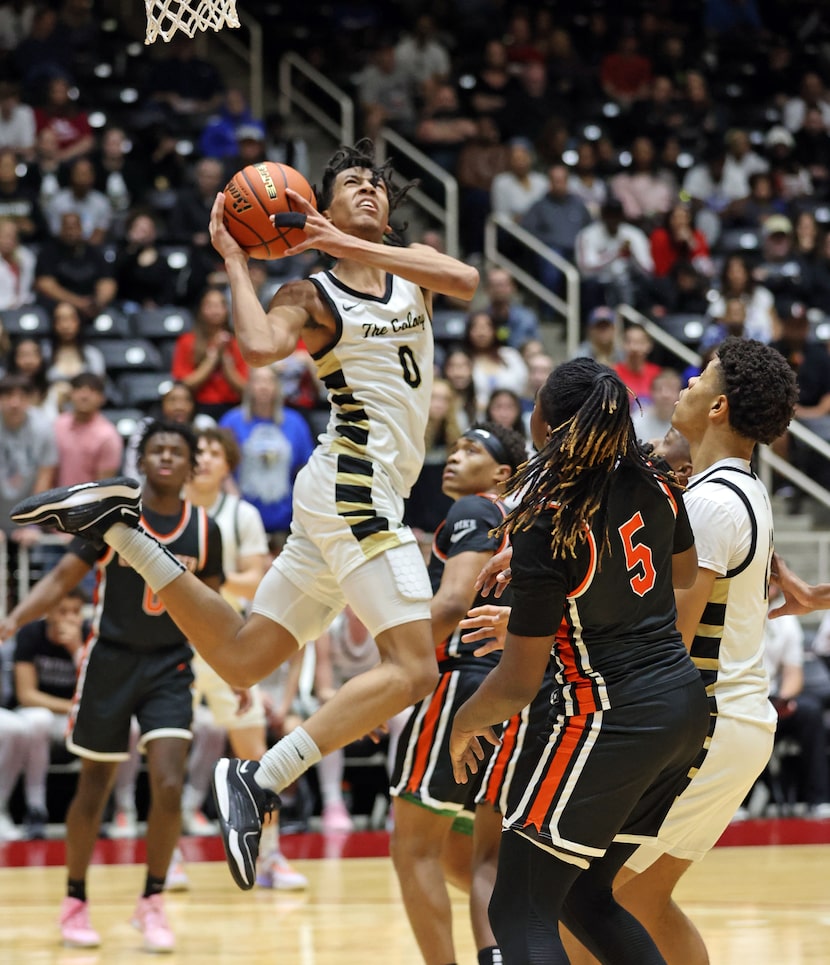 The Colony's Dakari Spear (0) gets a shot away under pressure from Lancaster high defenders...