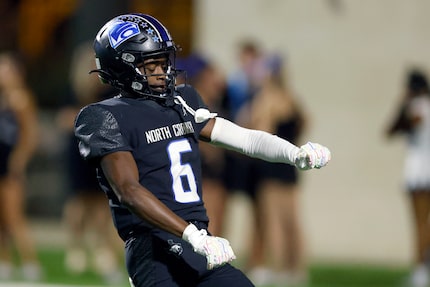 North Crowley wide receiver Quentin Gibson (6) dances in the end zone after scoring a...