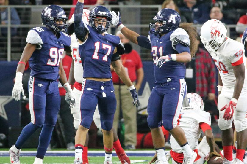 Allen defender Nigel Hines (17) celebrates a sack with teammates  Cody Dillard (96) and Misi...