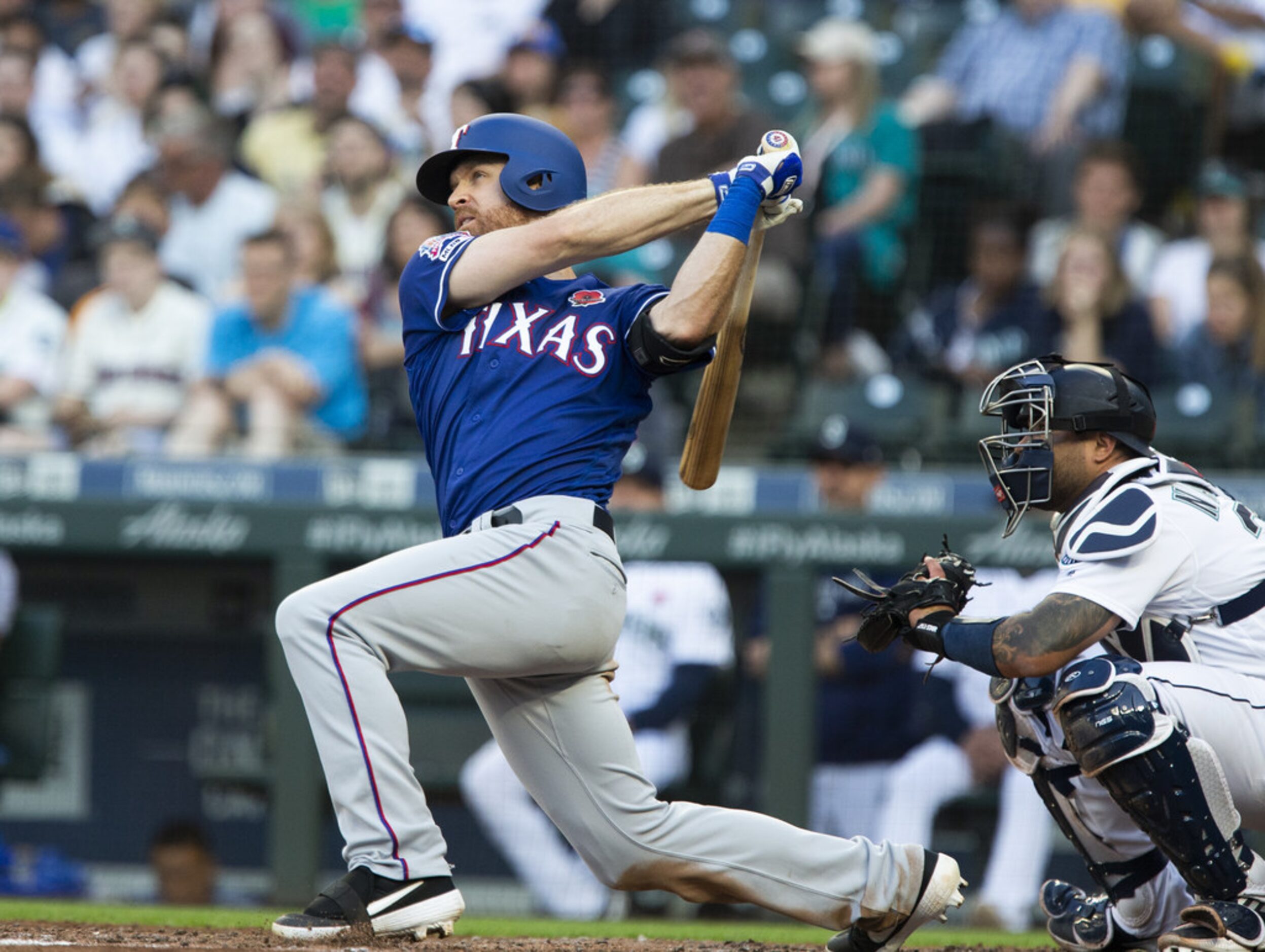 SEATTLE, WA - MAY 27:  Logan Forsythe #41 of the Texas Rangers follows through on an RBI...