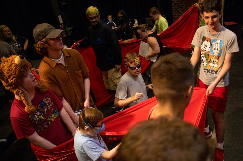 Jake McCormick (center) plays Lord Farquaad during rehearsal for Starcatchers production of...