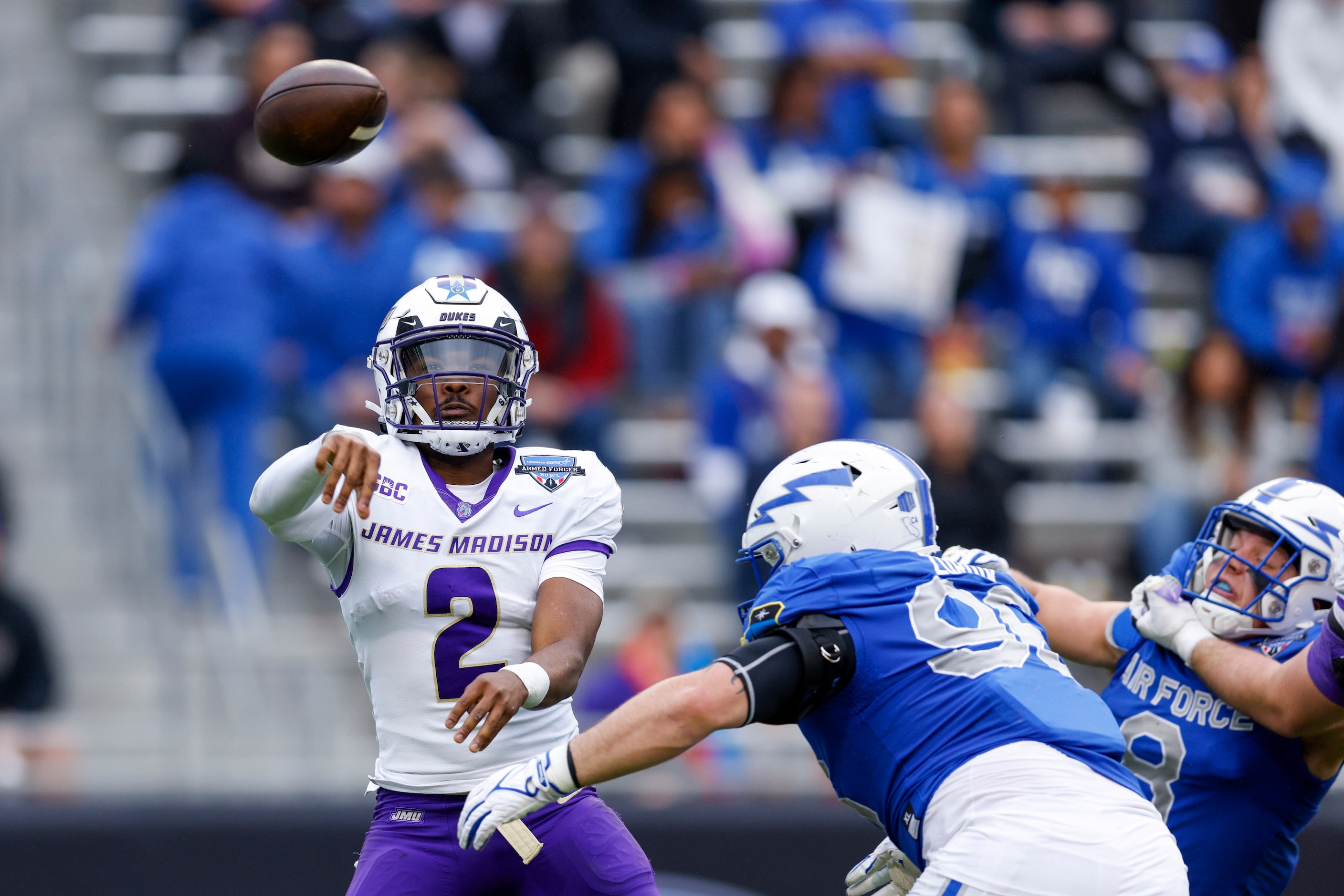 James Madison Dukes quarterback Jordan McCloud (2) throws under pressure from Air Force...