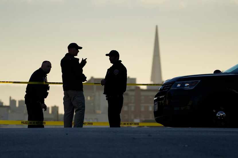 FILE - Police stand at the top of the closed street outside the home of House Speaker Nancy...