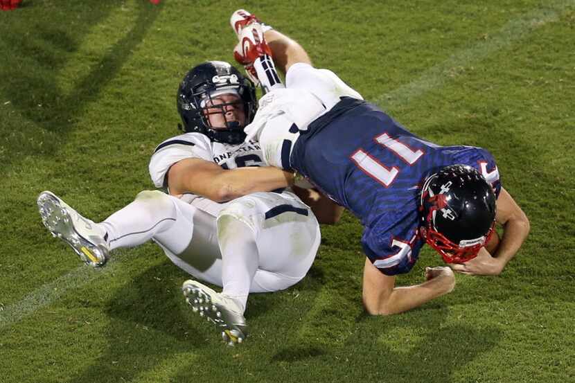 Lone Star's Jake Ray (16) tackles Centennial's Court Walker (11) during the second half of...