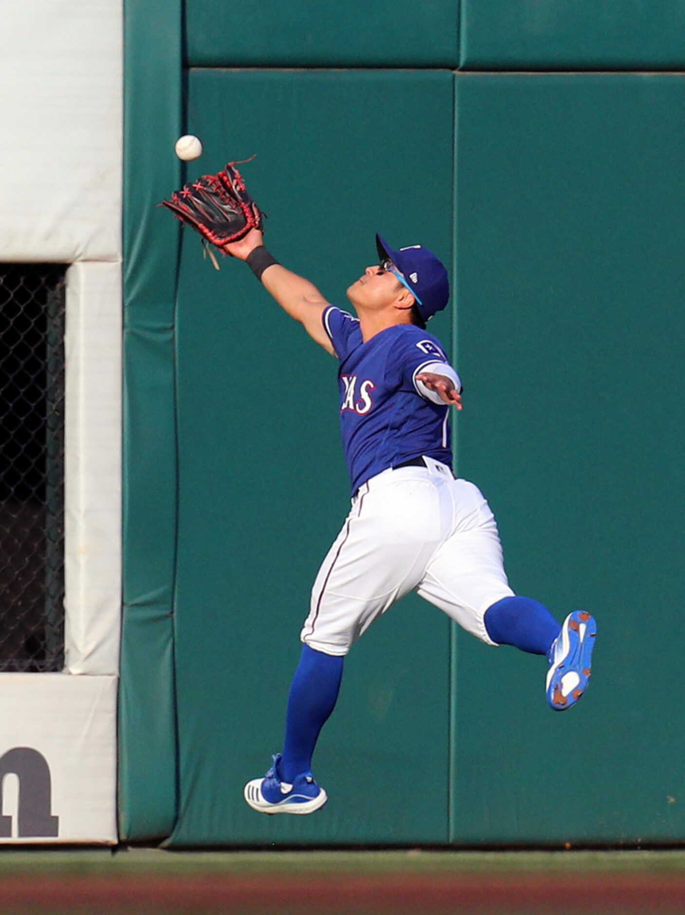 Texas Rangers left fielder Shin-Soo Choo (17) chases a ball hit by Arizona Diamondbacks...