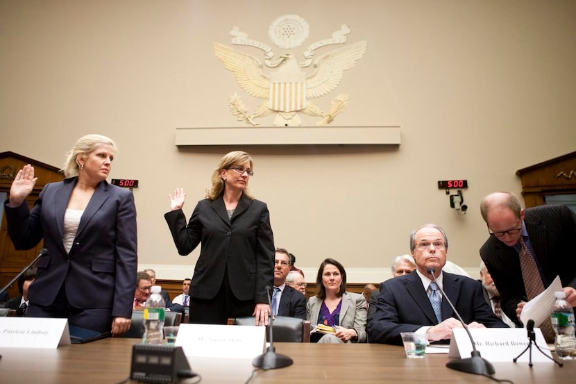 
Richard Bowen, second from right, prepares to be sworn in before testifying along with...