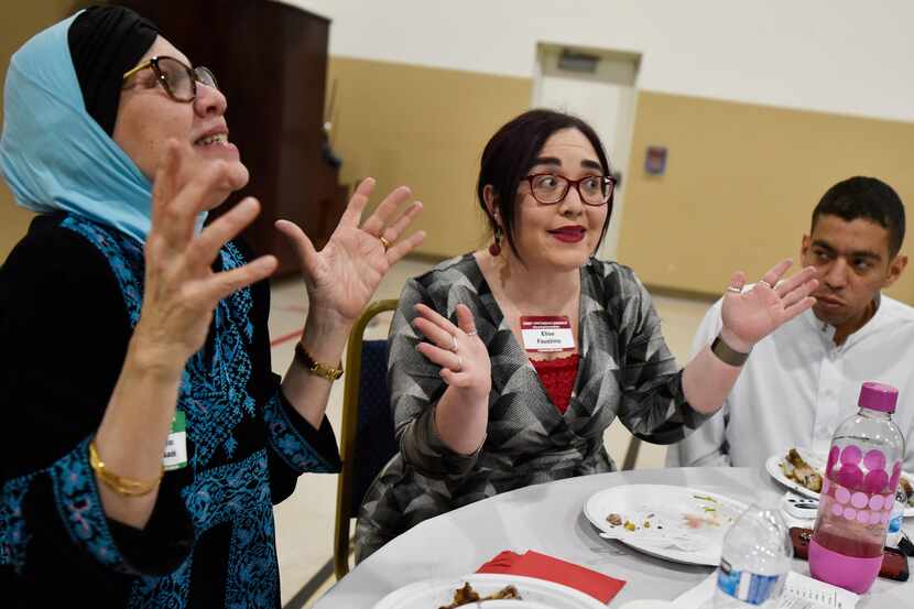 Noor Saadeh (left) of the Islamic Association of North Texas steering committee, Elise...