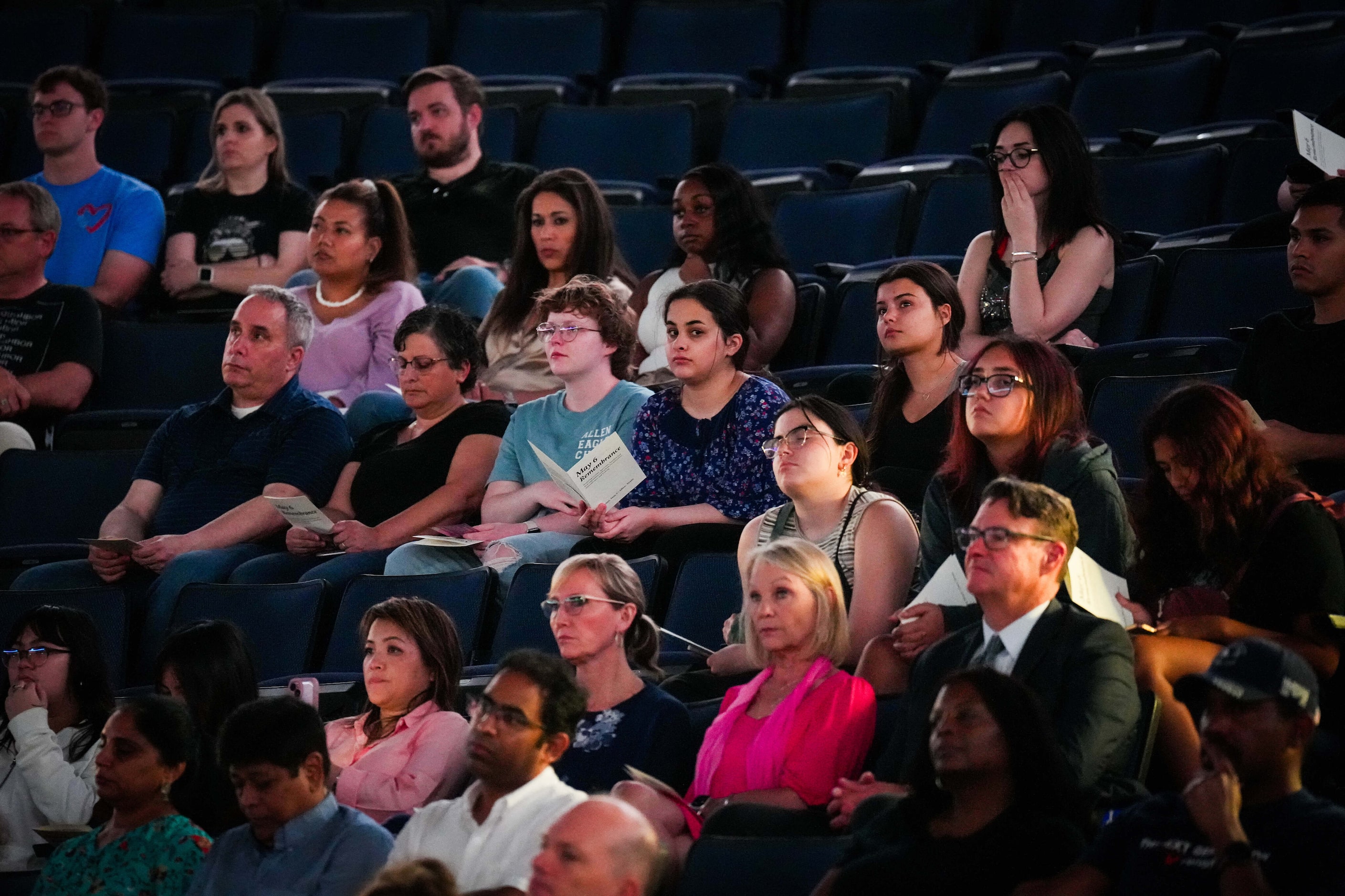 People listen as the Allen Philharmonic Orchestra plays during a remembrance event at Credit...