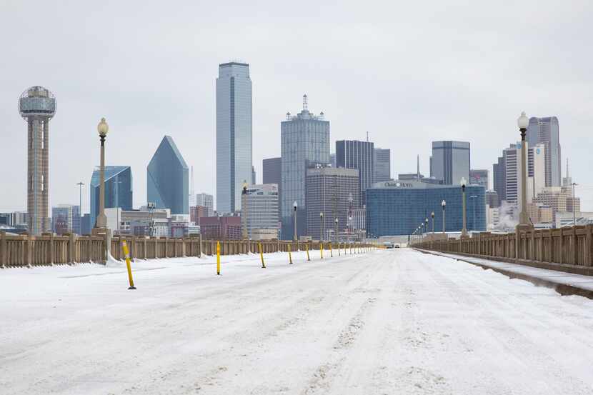 A snow-covered Downtown Dallas seen from S Houston St on Monday, Feb. 15, 2021.