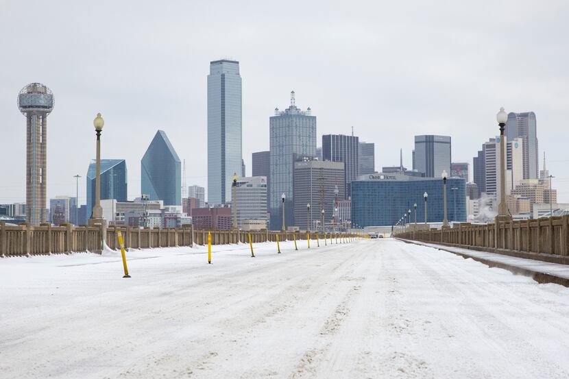 A snow-covered Downtown Dallas seen from S Houston St on Monday, Feb. 15, 2021.