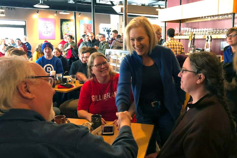 Sen. Kirsten Gillibrand, D-N.Y., greets patrons at Stomping Grounds Cafe in Ames, Iowa, on...