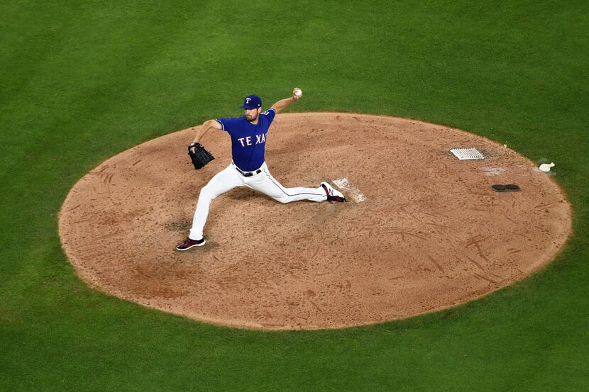 Texas Rangers starting pitcher Cole Hamels works against the New York Yankees during the...