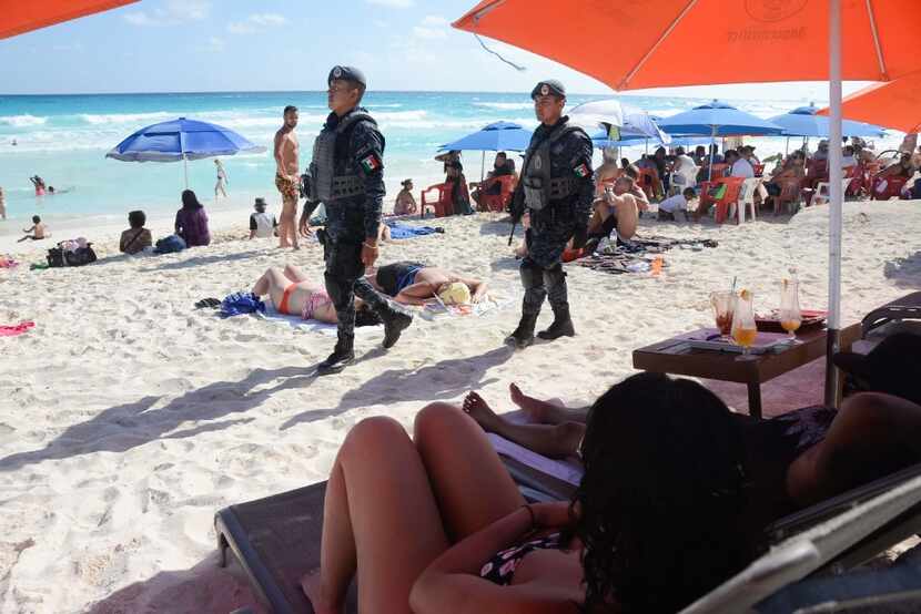This file photo taken on January 18, 2017 shows Mexican Federal Police patrolling a beach in...