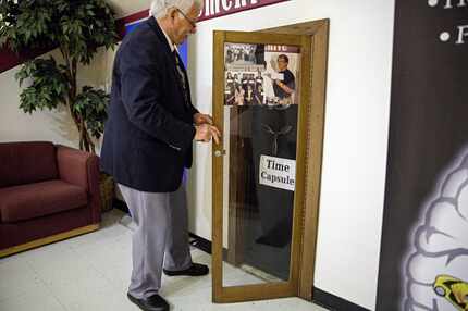 Bill Betzen unlocks at time capsule safe at Raul Quintanilla Sr. Middle School Friday, April...