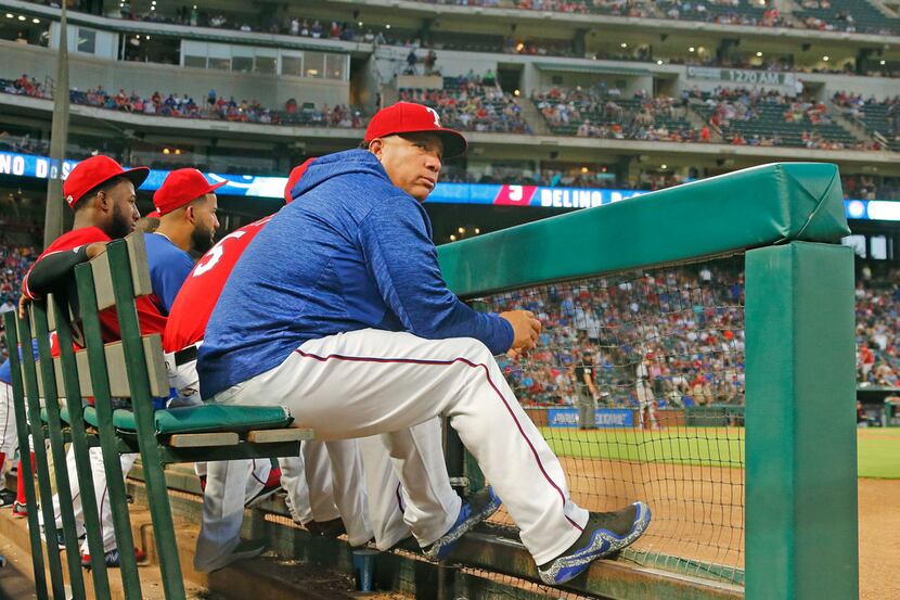 FILE - Texas Rangers starting pitcher Bartolo Colon (40) wears a hooded sweatshirt on the...