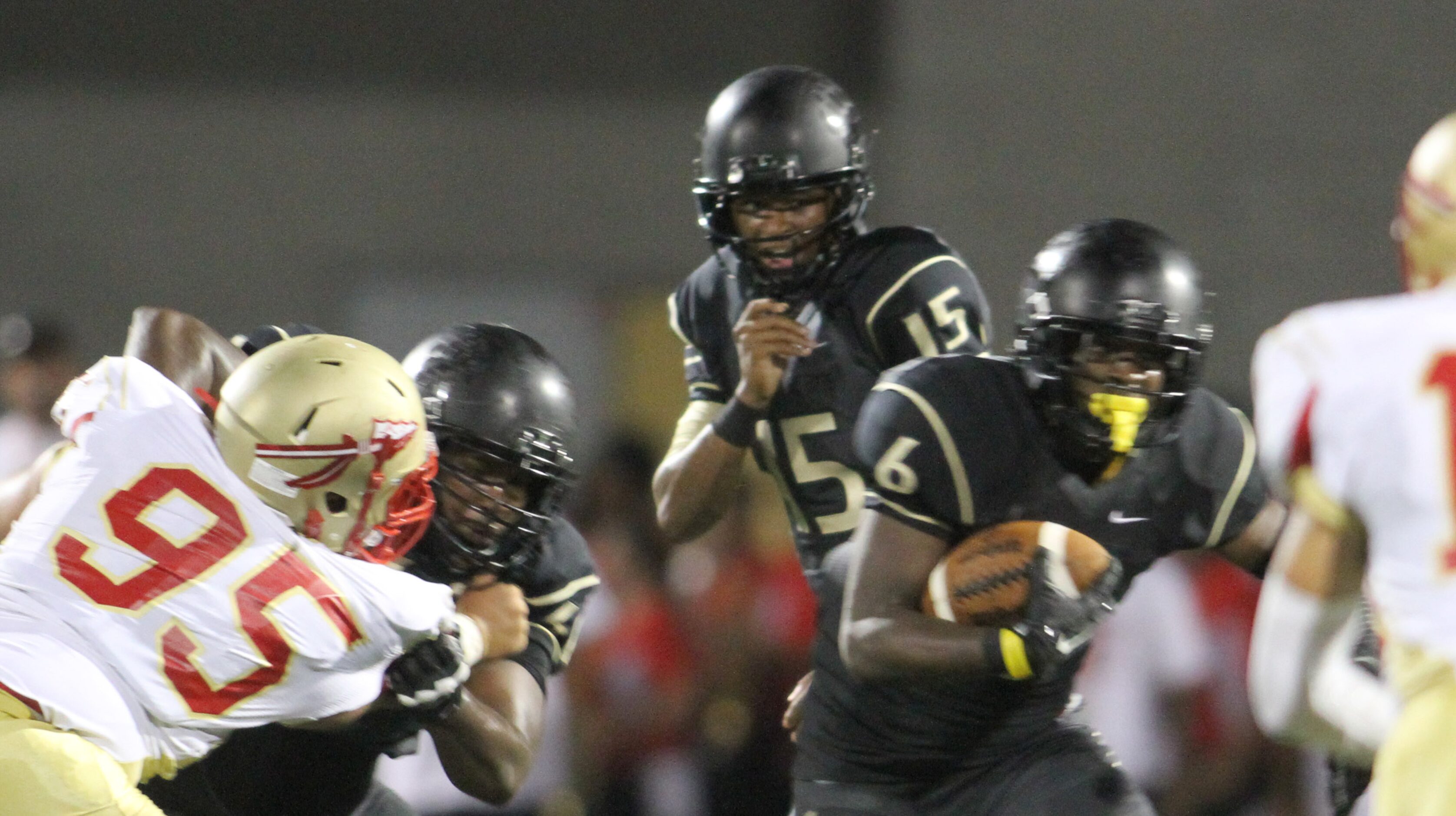 South Oak Cliff quarterback David Johnson (15) hands the ball off to running back Jordan Ray...