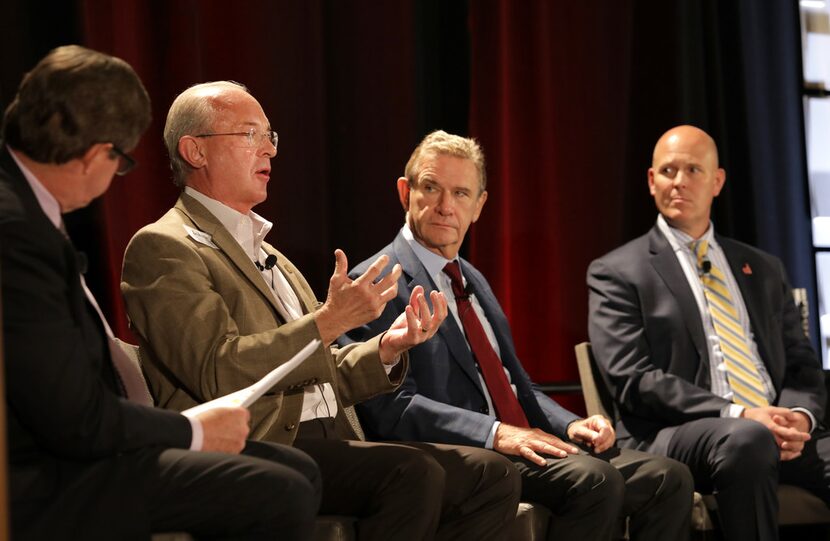 John Lettelleir, (second from left) director of development services for the city of Frisco,...