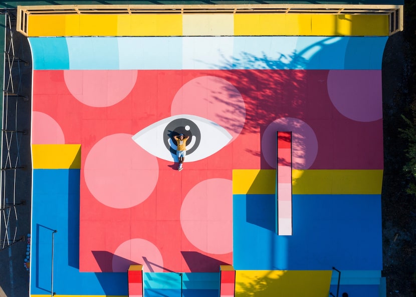 Drigo Rodriguez lies on top of the skatepark he painted for Zumiez.