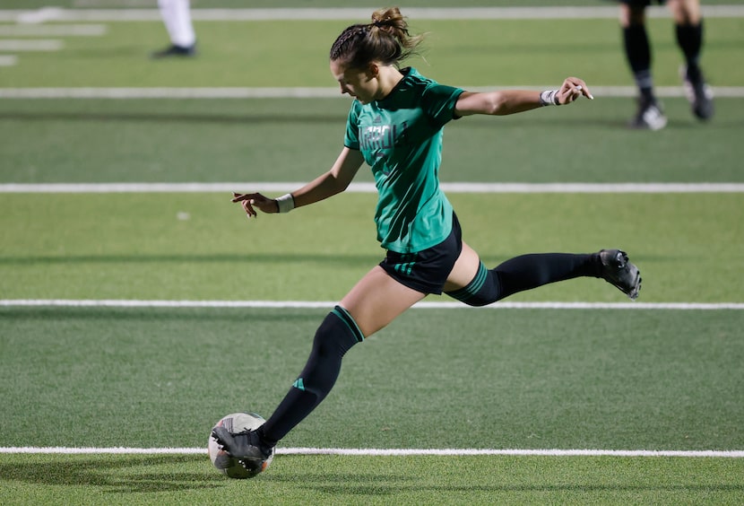 Southlake Carroll midfielder Kamdyn Fuller (10) takes a late second half shot against Trophy...