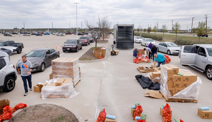 Community Lifeline Center volunteers and staff distributed food in the parking lot of...