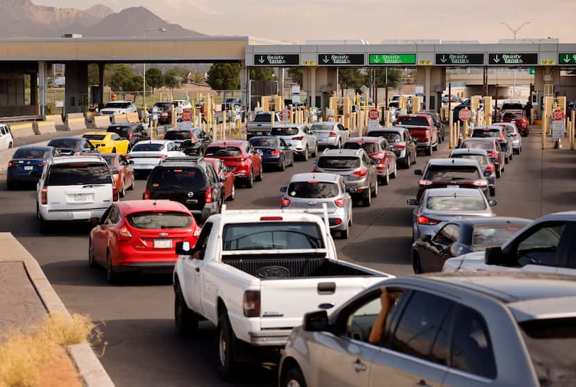 Lines of vehicles approach the Bridge of the Americas international port of entry inspection...