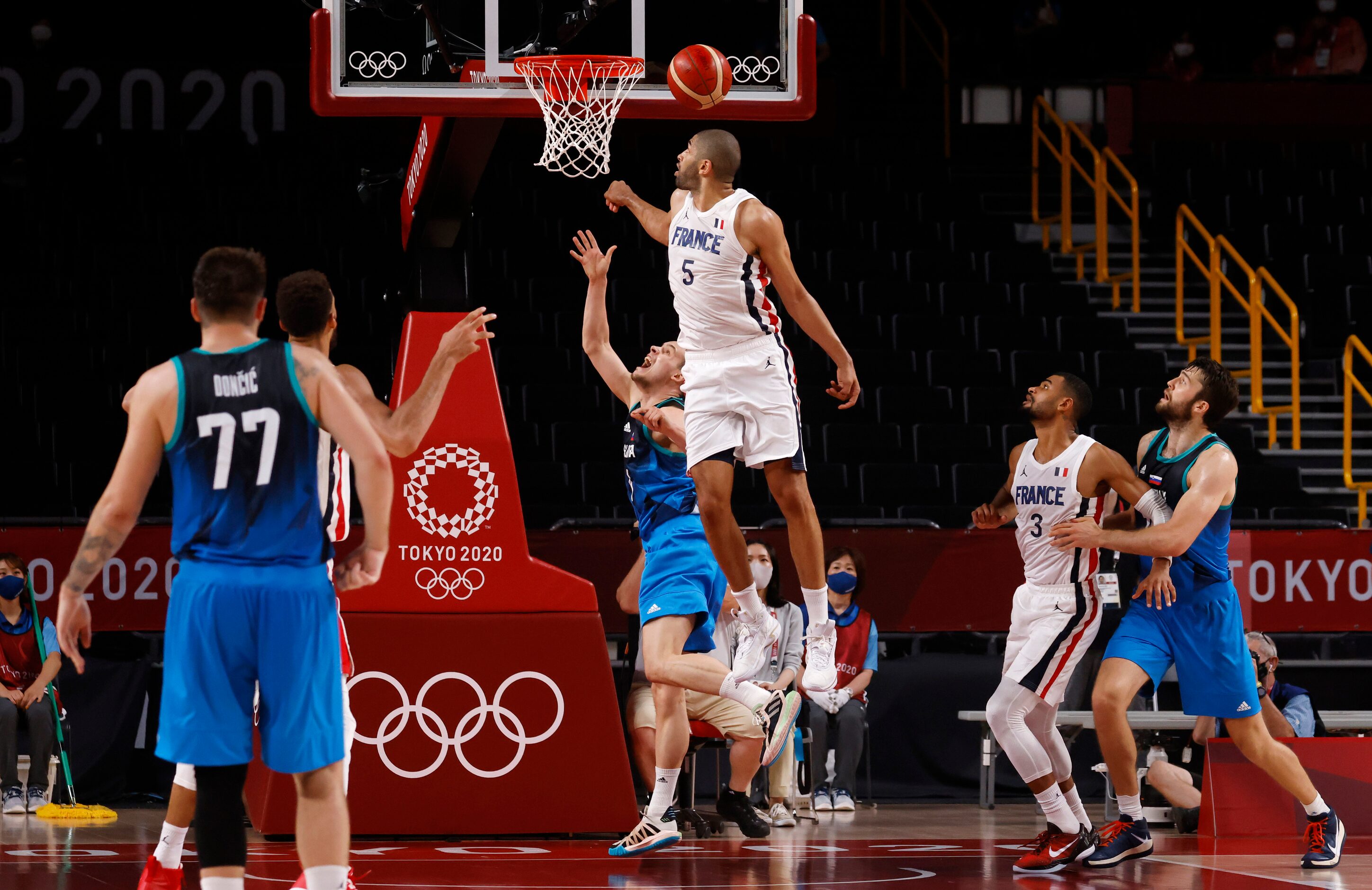 Slovenia’s Klemenn Prepelic (7) last second shot is blocked by France’s Nicolas Batum (5) at...