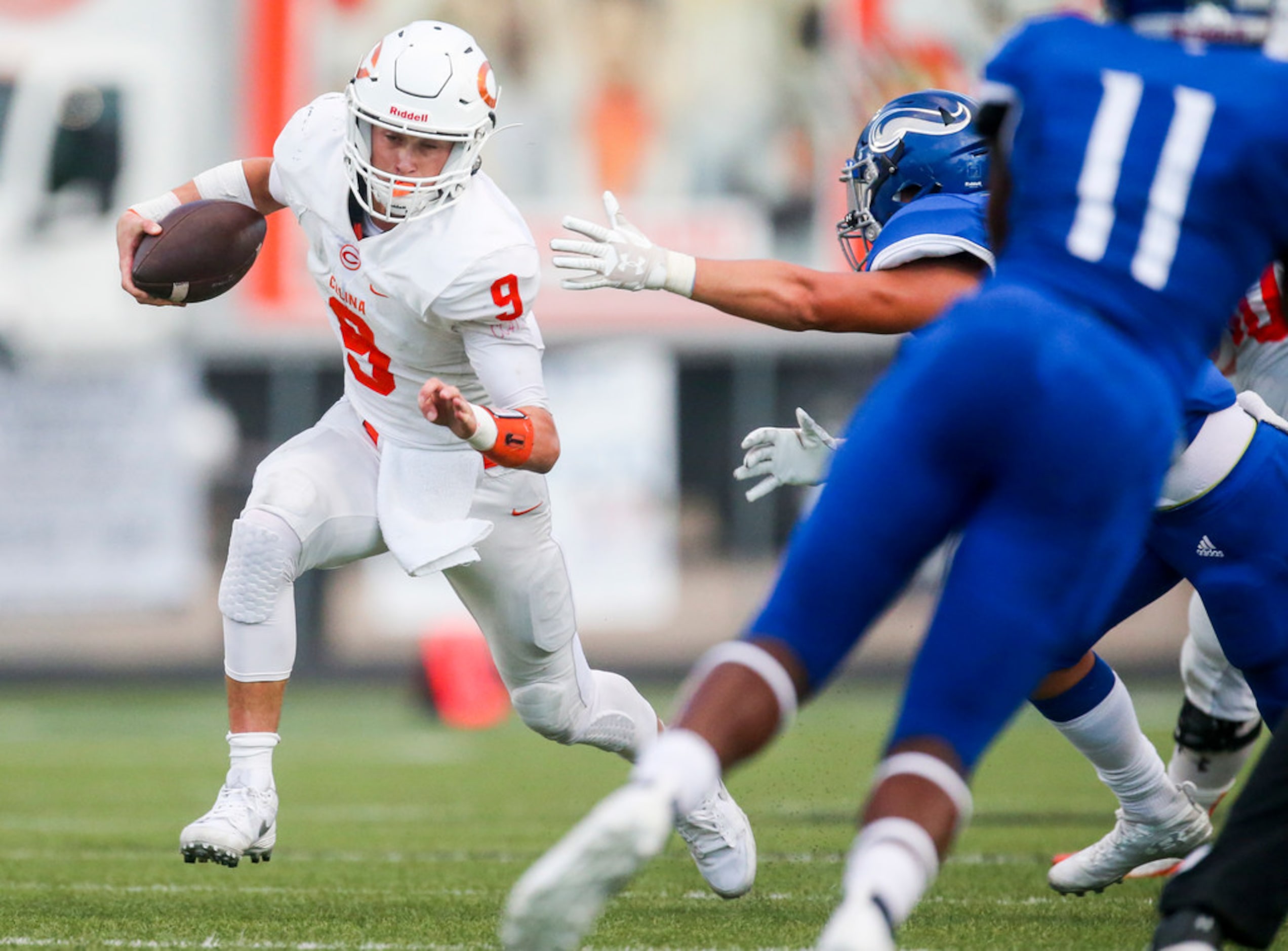 Celina quarterback Hunter Watson (9) carries the ball during a high schools football game at...