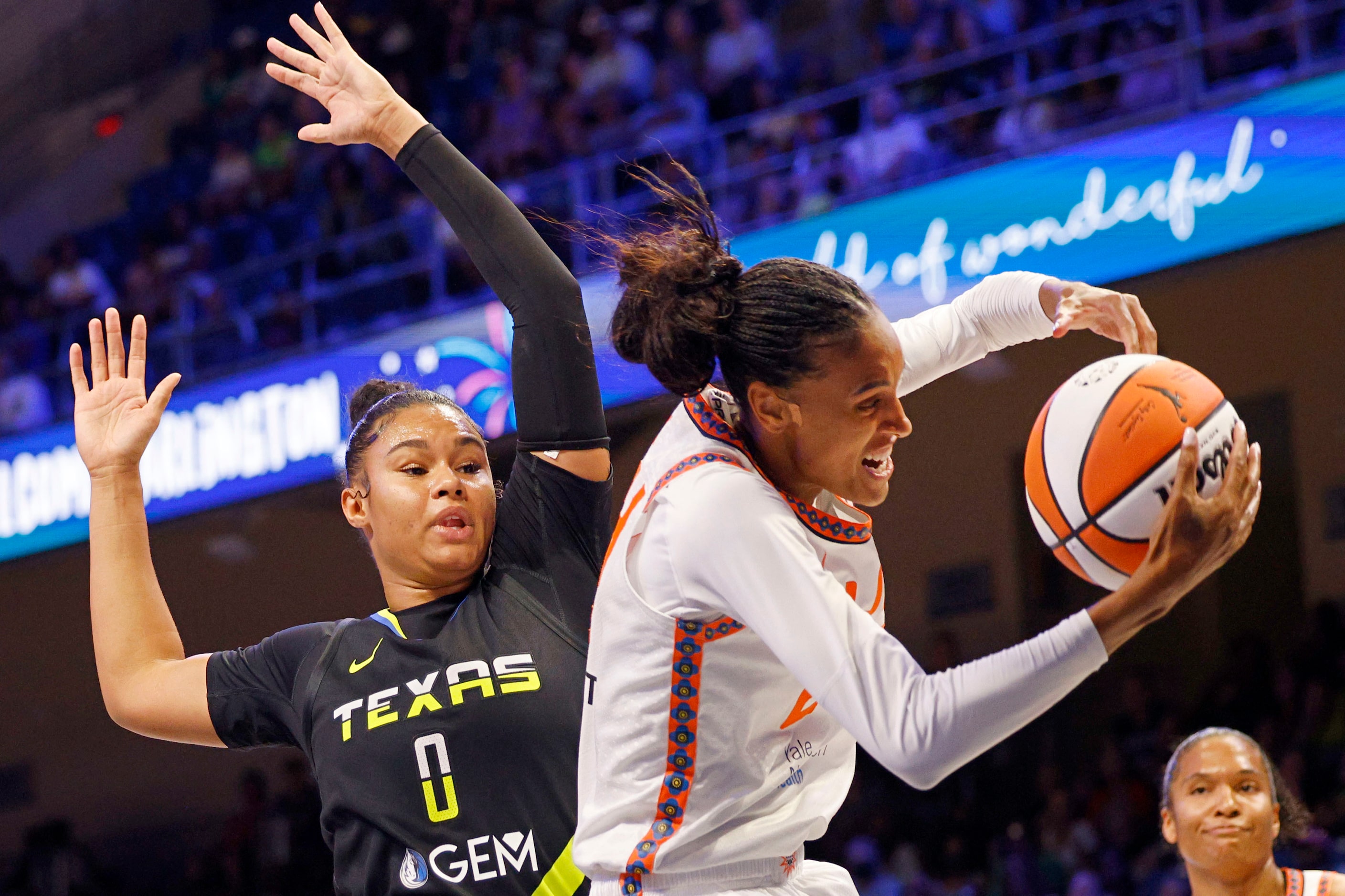 Dallas Wings forward Satou Sabally (0) and Connecticut Sun forward DeWanna Bonner (24)...