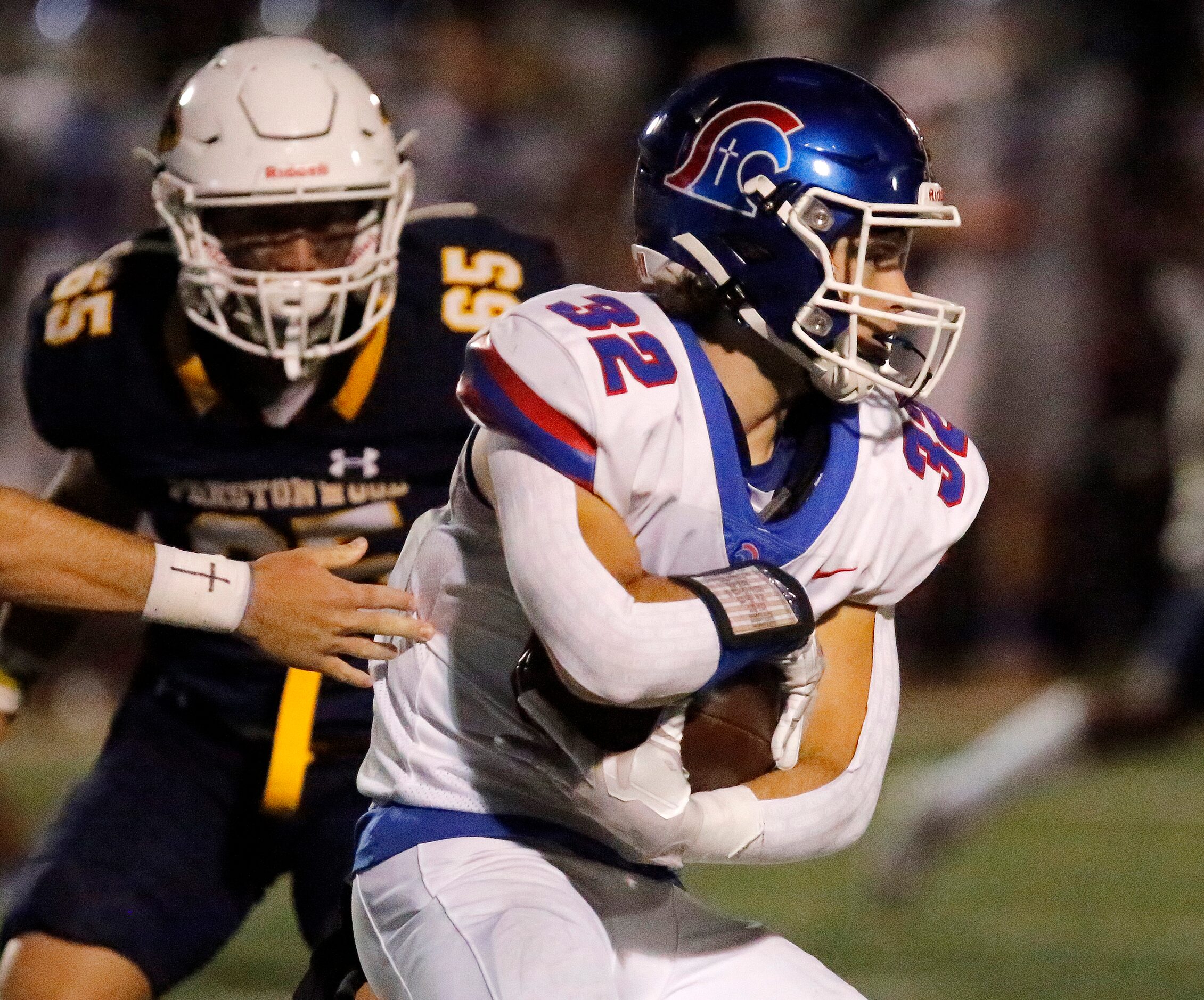 Trinity Christian Academy running back Jameson Dunigan (32) looks for running room during...