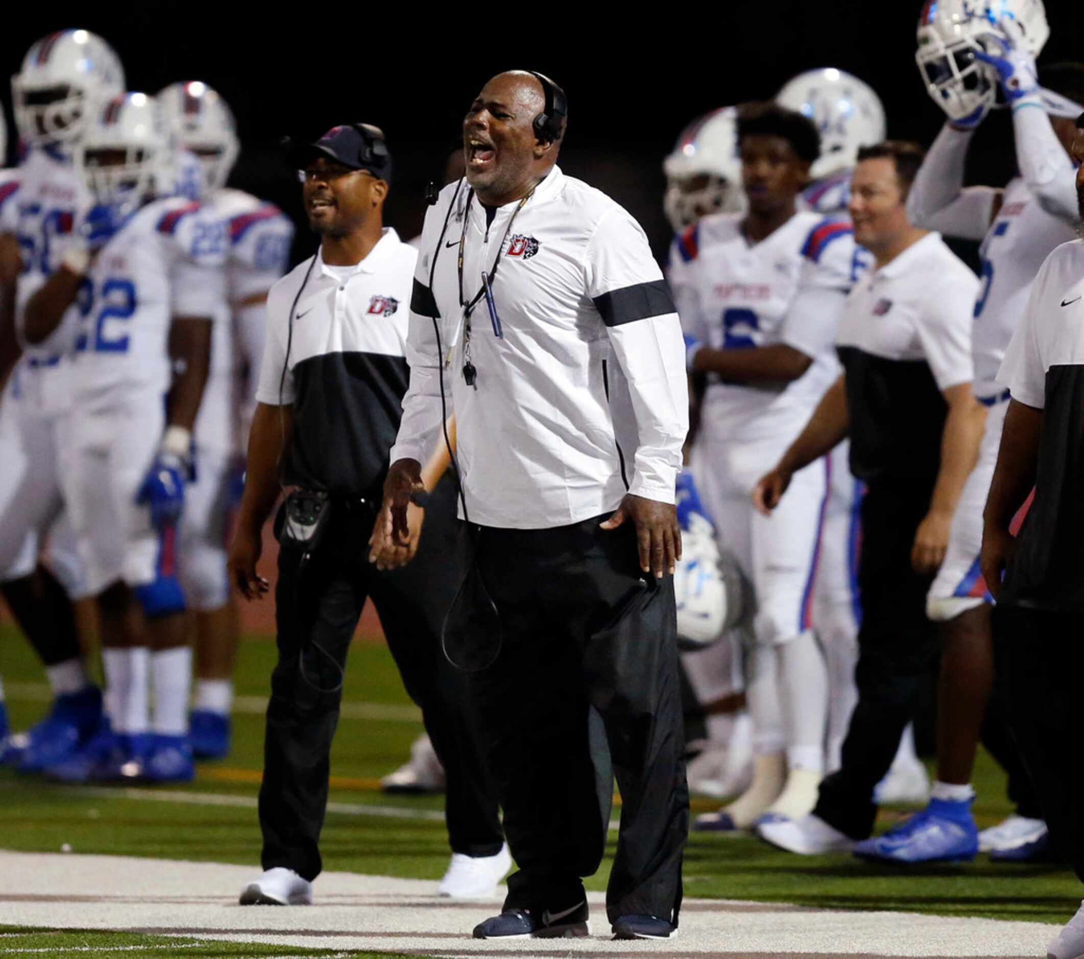 Duncanville head coach Reginald Samples yells instruction to his players during the fourth...