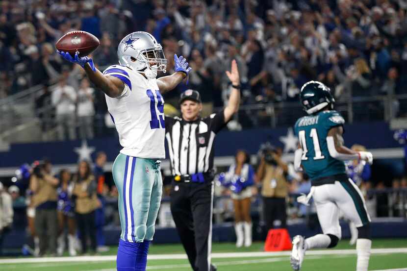 Dallas Cowboys wide receiver Amari Cooper (19) celebrates a touchdown after a long fourth...