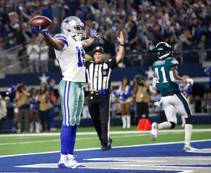 Dallas Cowboys wide receiver Amari Cooper (19) celebrates a touchdown after a long fourth...