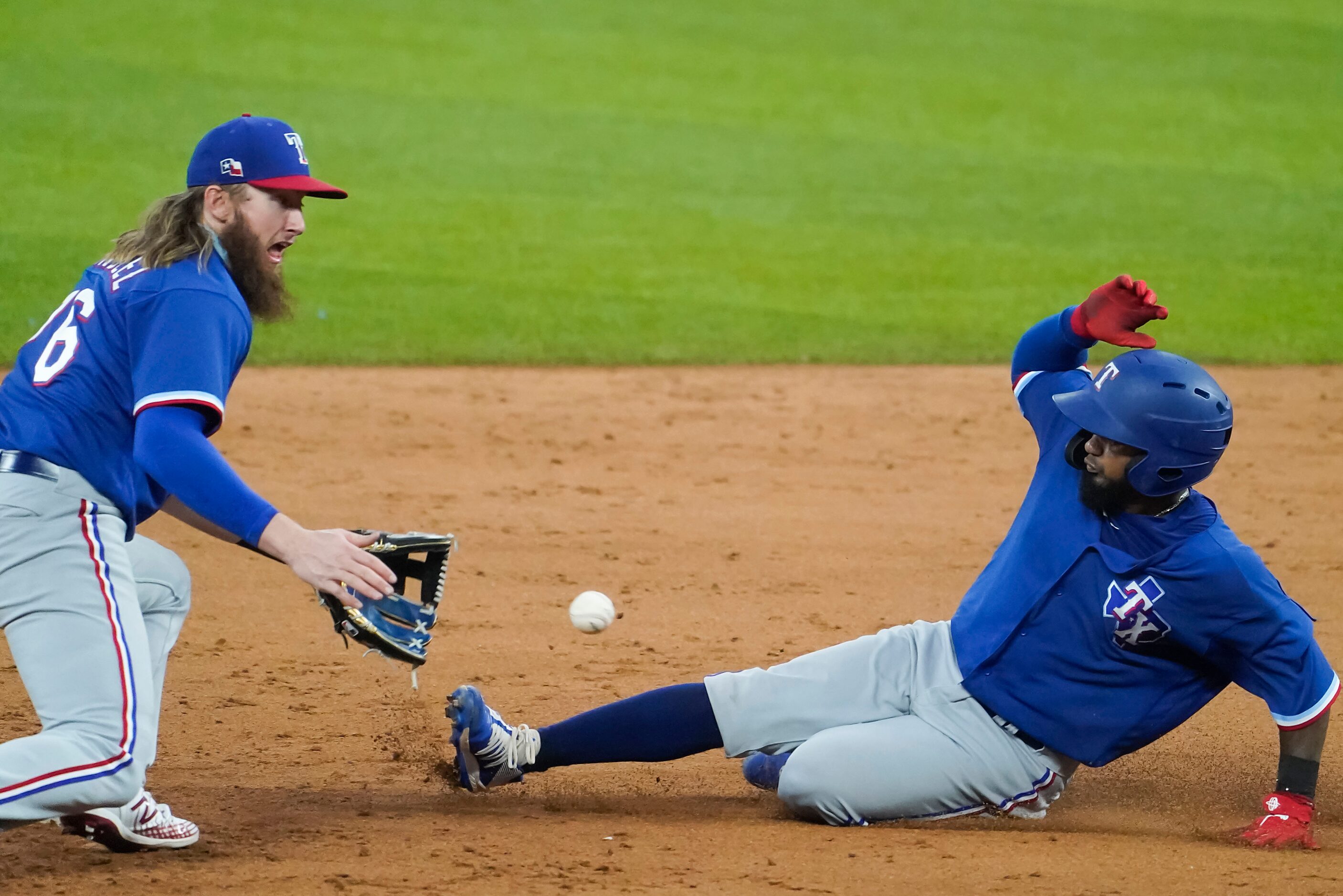 Texas Rangers infielder Davis Wendzel takes the throw as Yonny Hernandez attempts to steal...