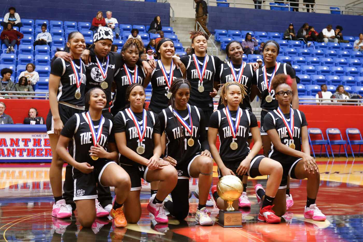 Duncanville high pose for a celebratory photo following their victory against Conway in...