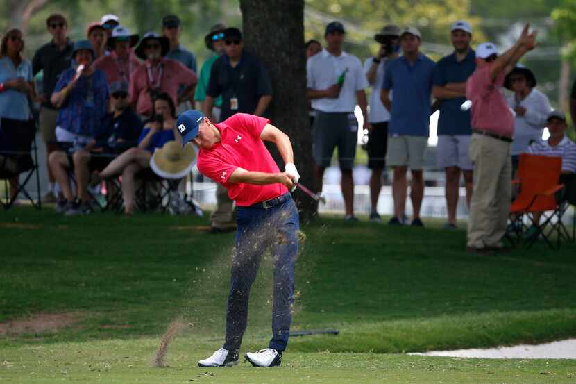 Jordan Spieth hits his second shot on the 17th fairway during the third round of Fort Worth...