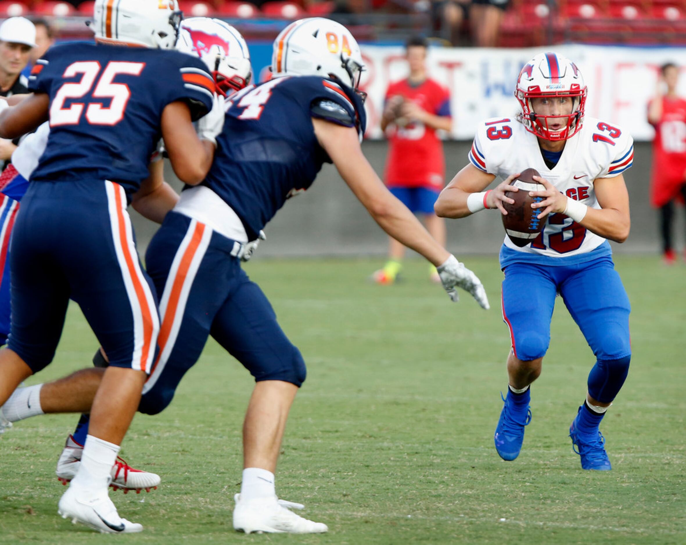 Richardson Pearce High School quarterback Blake Waters (13) looks for room to run as he...