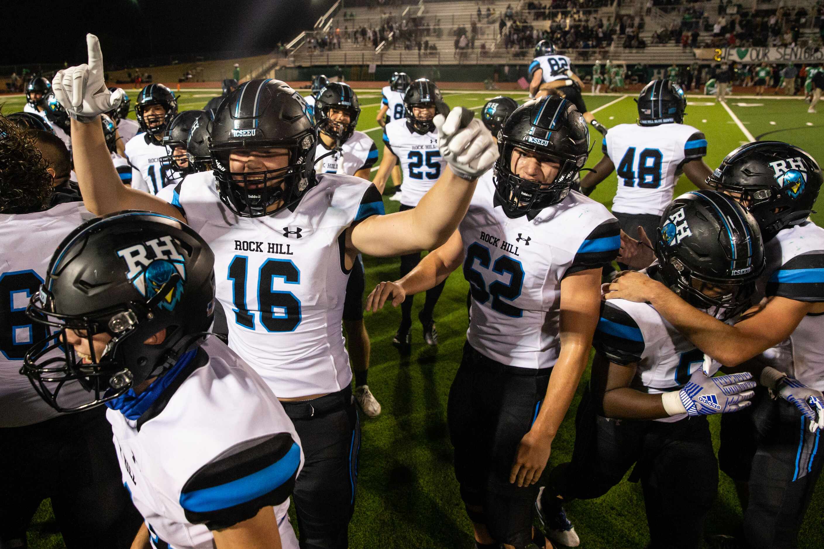Players celebrate their win over Lake Dallas following the District 7-5A Division II game...