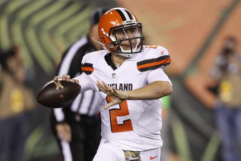 Cleveland Browns quarterback Johnny Manziel looks to pass on the run in the second half of...